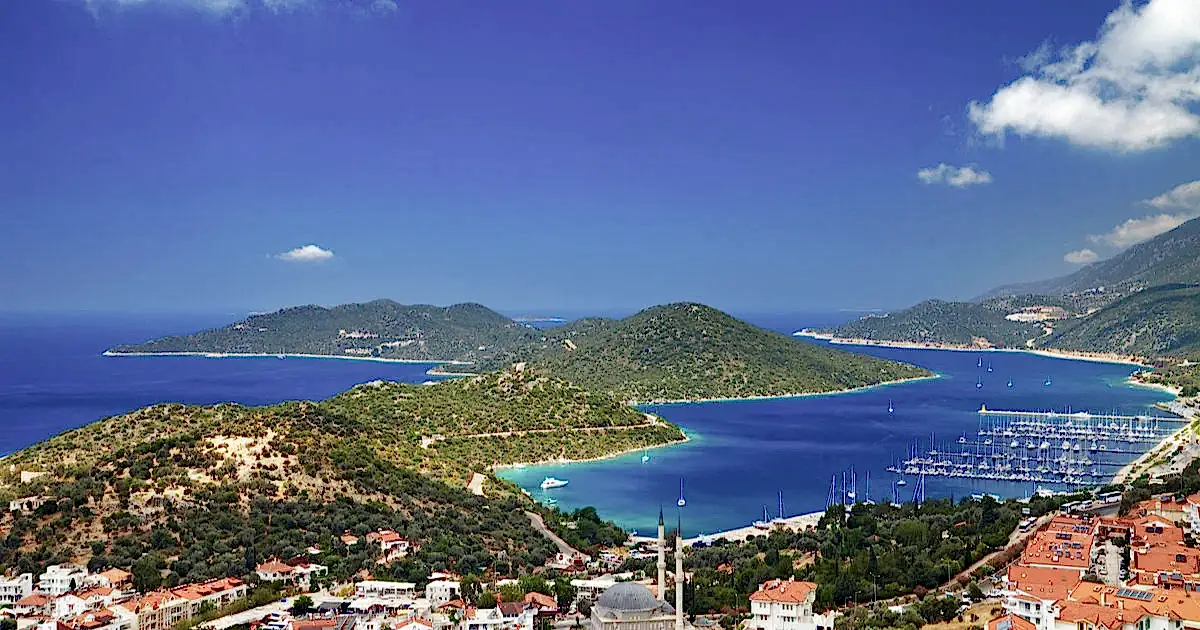 Aerial view of Kaş coastline, turquoise waters, and charming town during a helicopter transfer from Antalya