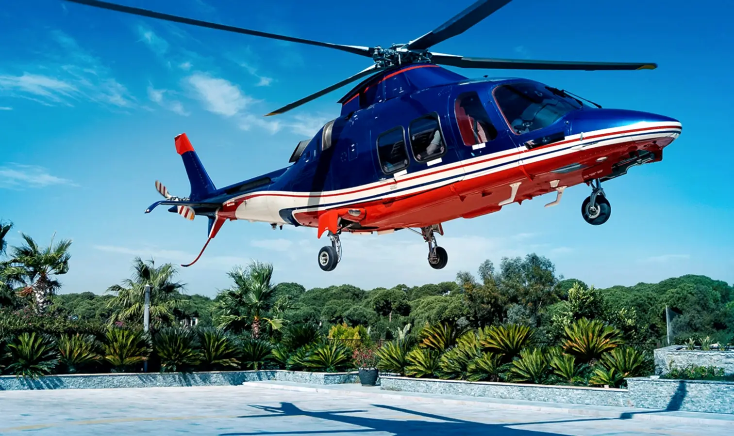 A helicopter taking off for an Antalya helicopter tour, soaring into the sky with breathtaking coastal and city views ahead.