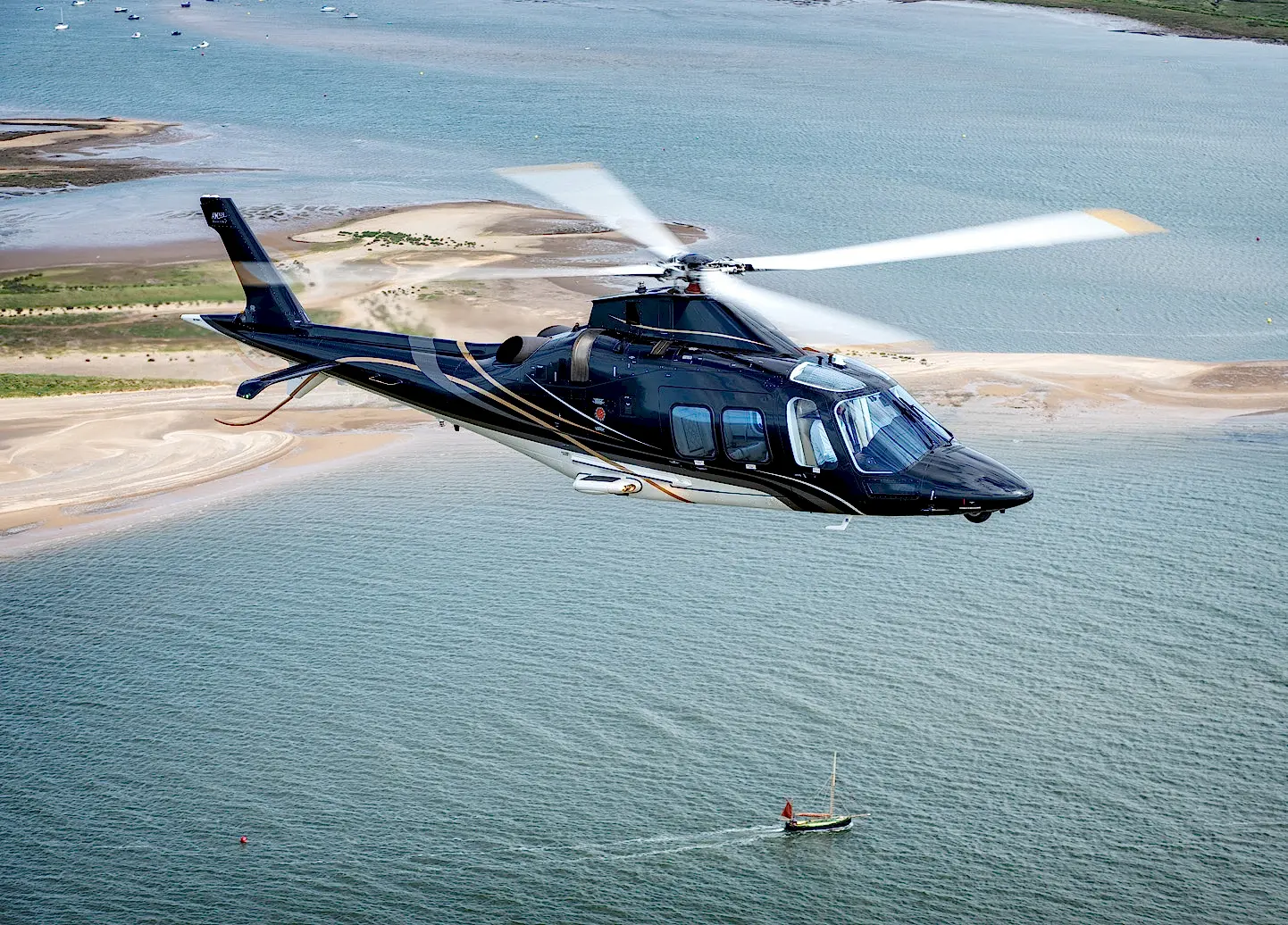 A helicopter flying over Belek, offering breathtaking panoramic views of its stunning coastline, luxury resorts, and lush green landscapes.